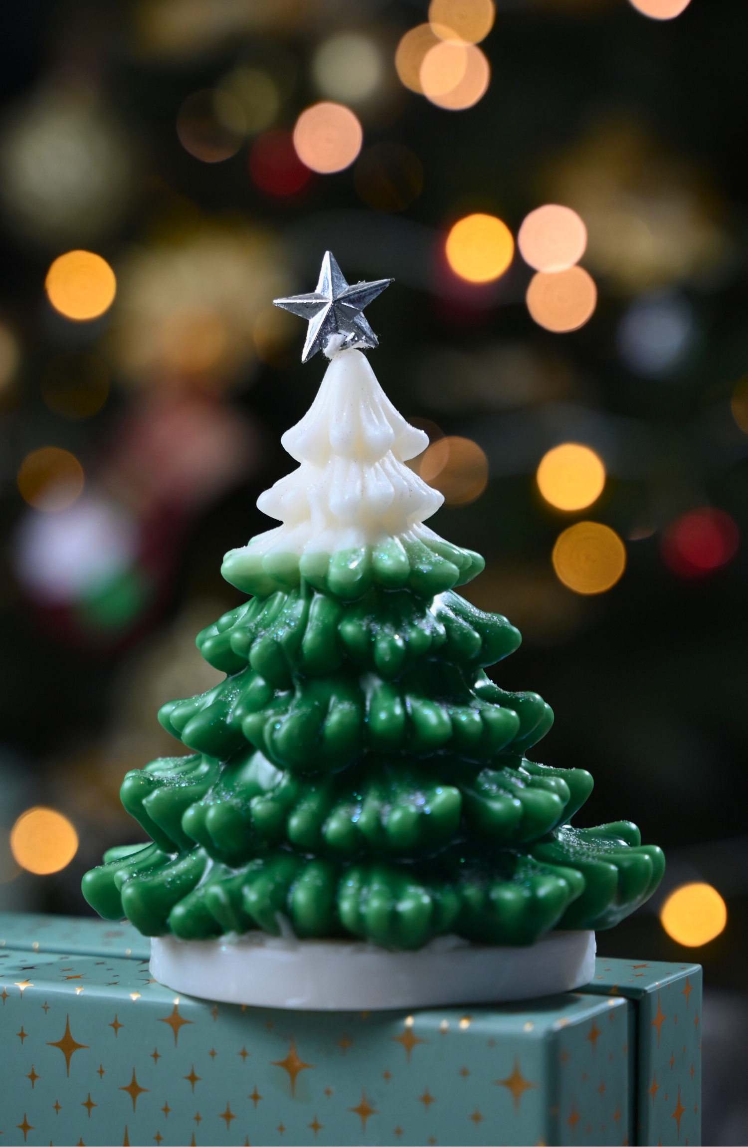 "Green and white Christmas tree candle with star — soy wax holiday decor Hand-poured Christmas tree candle in green and white with festive star Soy wax scented holiday candle shaped like a Christmas tree Rey of Light festive Christmas tree candle for holiday gifting"